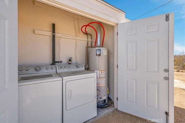 laundry area featuring laundry area, gas water heater, and washing machine and dryer