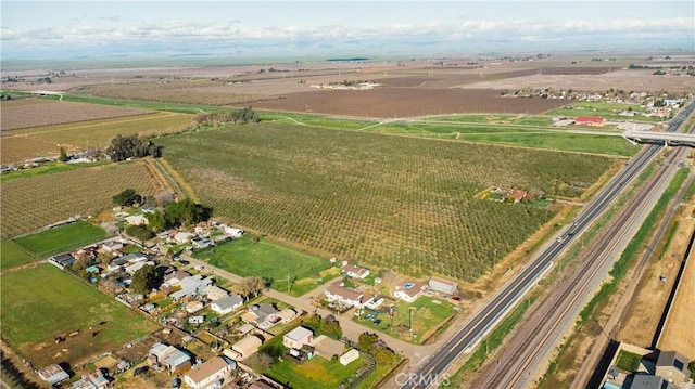 birds eye view of property with a rural view