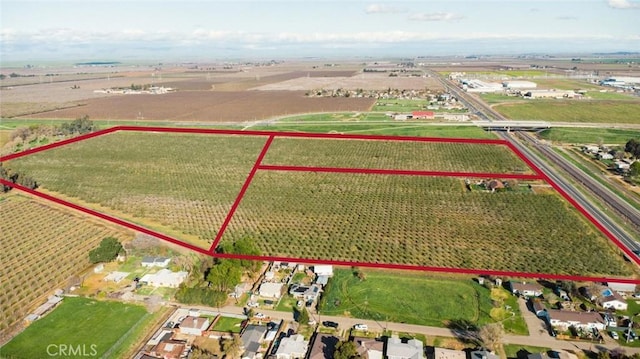 birds eye view of property with a rural view