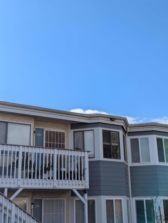 view of home's exterior featuring a balcony