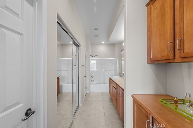 full bath featuring recessed lighting, tile patterned flooring, and vanity