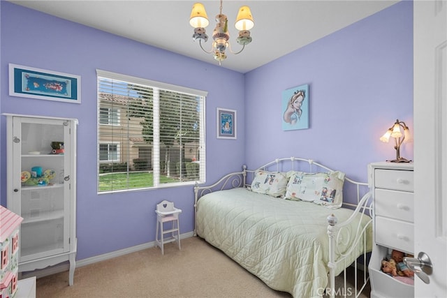 bedroom with baseboards, carpet, and a notable chandelier