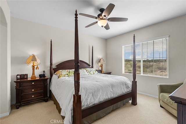 bedroom featuring a ceiling fan, carpet, and baseboards