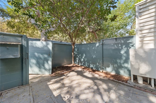 view of gate featuring fence