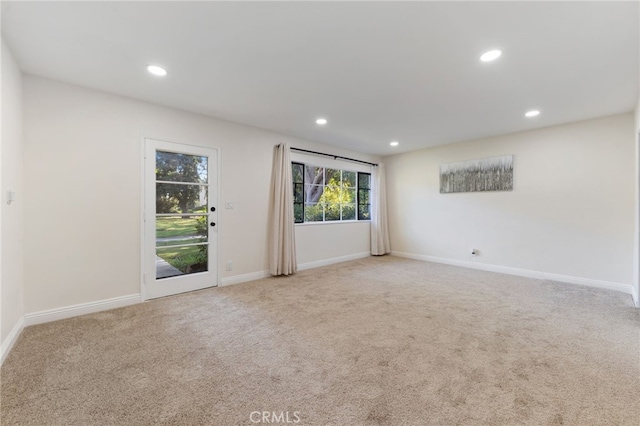 unfurnished room with carpet floors, recessed lighting, and baseboards