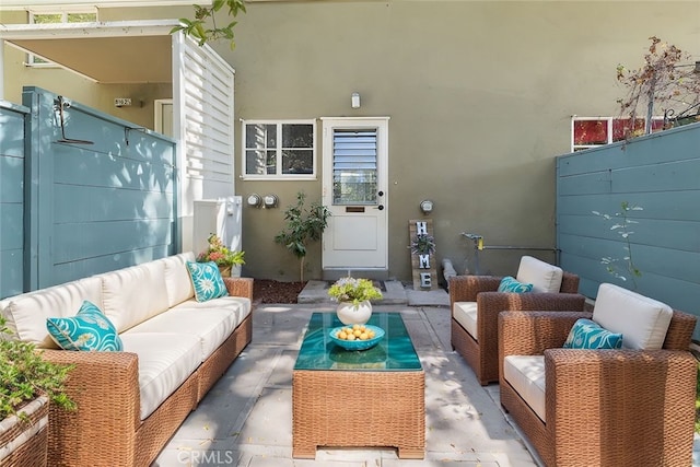 exterior space with fence and an outdoor living space