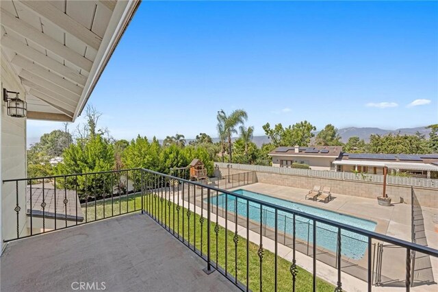 balcony with a mountain view and a patio