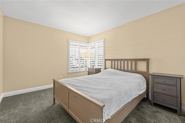 carpeted bedroom featuring baseboards