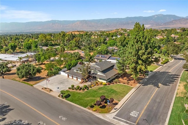 birds eye view of property featuring a mountain view