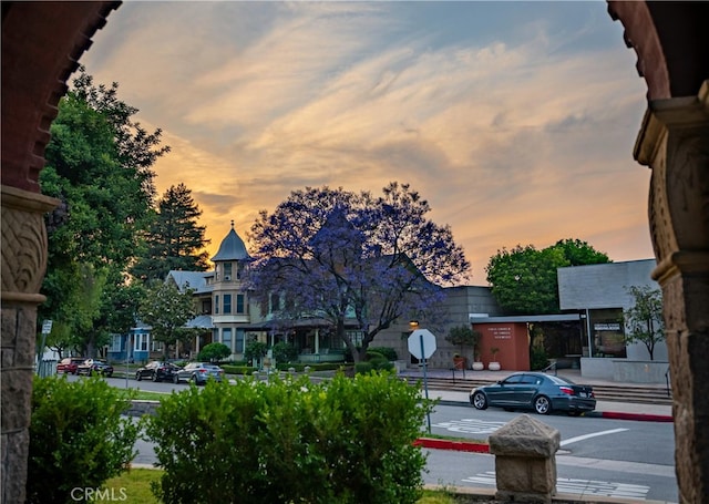 view of street featuring sidewalks and traffic signs