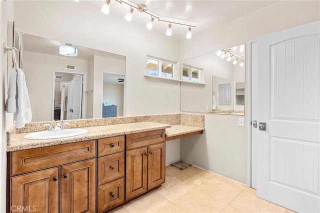 bathroom featuring visible vents, tile patterned flooring, and vanity