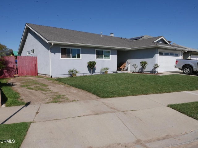 ranch-style house with concrete driveway, an attached garage, a front lawn, and stucco siding