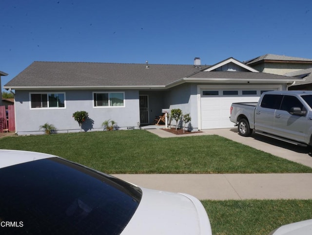 single story home with a garage, concrete driveway, roof with shingles, a front yard, and stucco siding