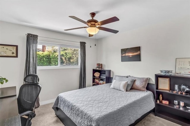 bedroom with carpet floors, ceiling fan, and baseboards