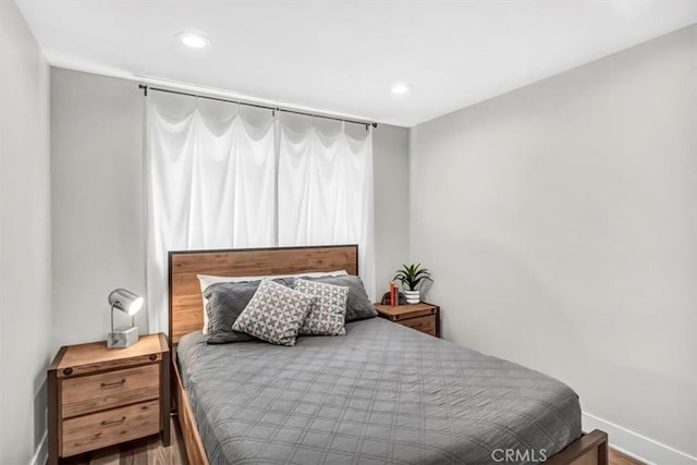 bedroom featuring recessed lighting and baseboards