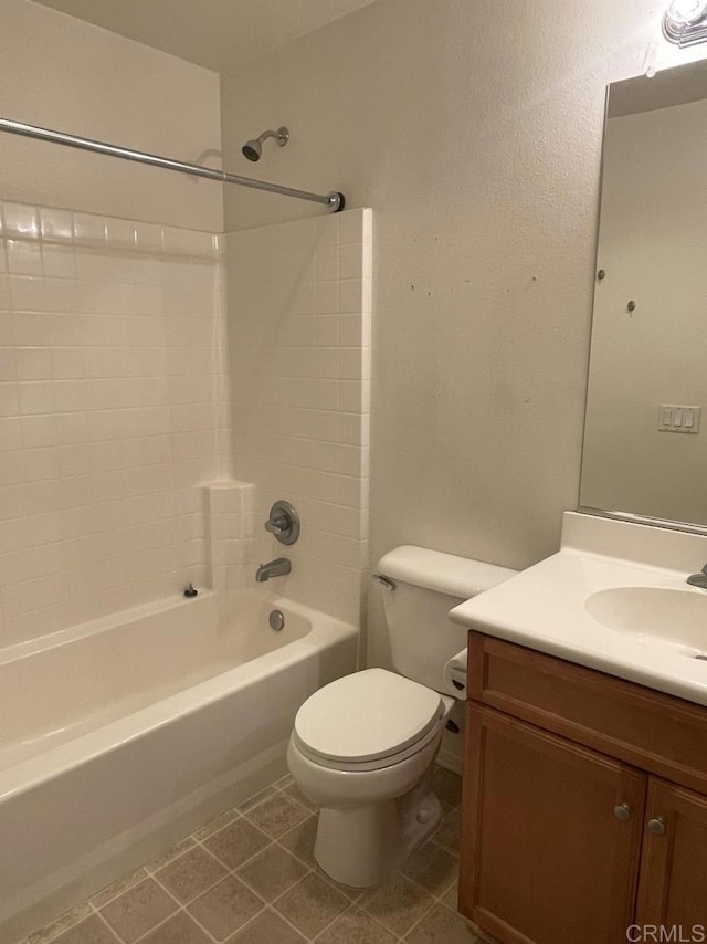 full bathroom with washtub / shower combination, vanity, tile patterned flooring, and toilet