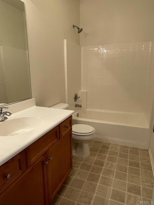 full bath featuring bathtub / shower combination, vanity, toilet, and tile patterned floors