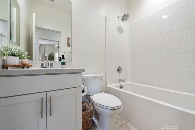bathroom with shower / washtub combination, toilet, and vanity