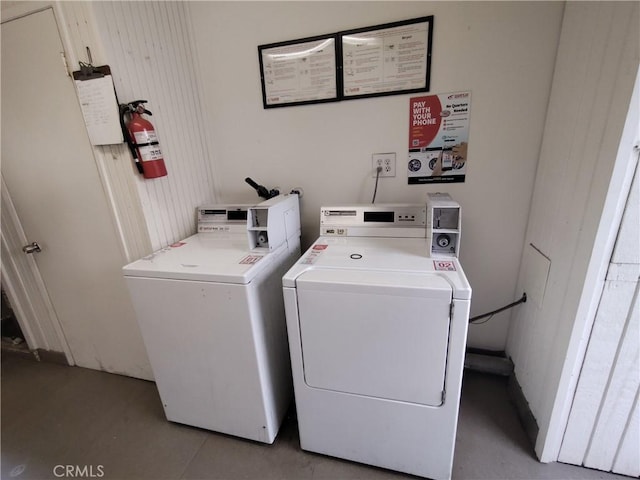 community laundry room featuring separate washer and dryer