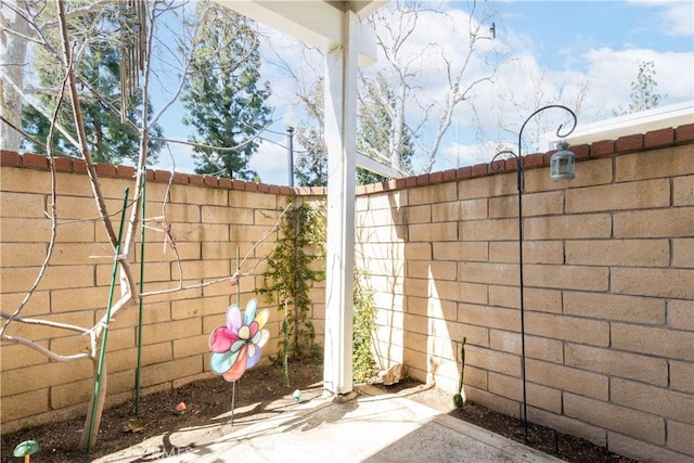 view of gate with fence