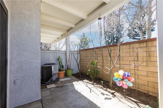 view of patio featuring a fenced backyard and cooling unit