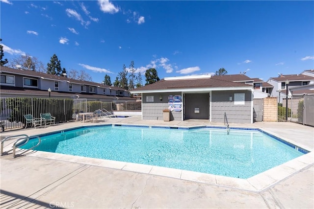 pool featuring a patio and fence