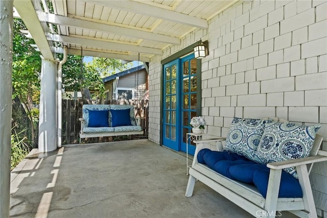 view of patio / terrace featuring french doors and a pergola