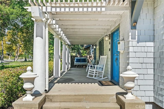 view of patio with a porch and a pergola