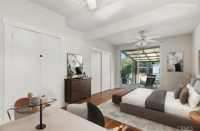 bedroom featuring access to exterior, two closets, ceiling fan, and wood finished floors