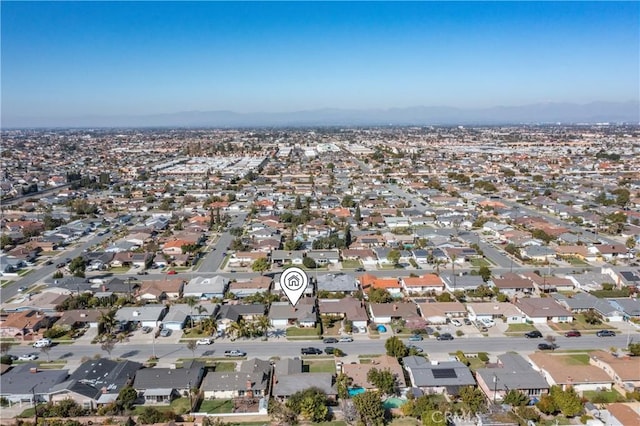 birds eye view of property with a residential view and a mountain view