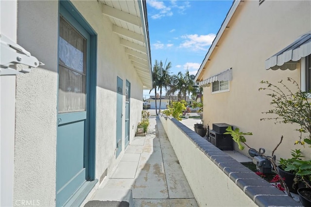 view of side of property with stucco siding