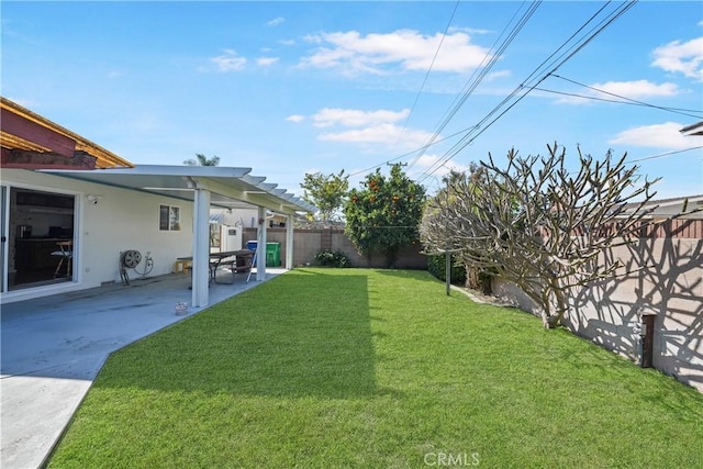 view of yard featuring a patio and a fenced backyard