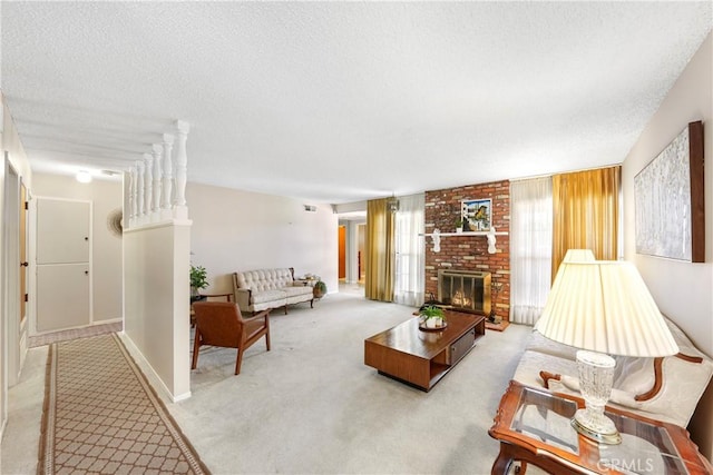 living room featuring a textured ceiling, a brick fireplace, carpet flooring, and visible vents