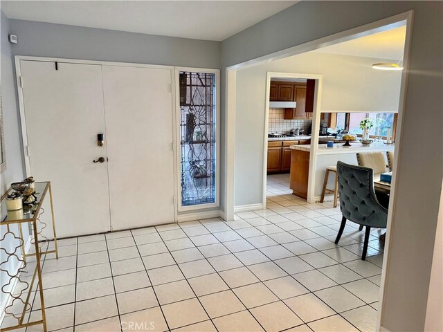 entryway with light tile patterned floors