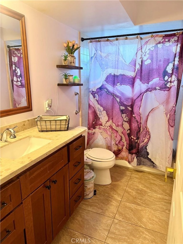 bathroom featuring toilet, a shower with curtain, and vanity