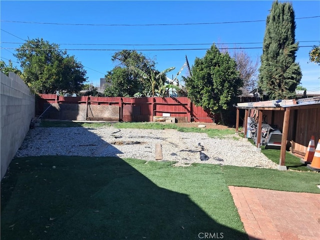 view of yard with a fenced backyard