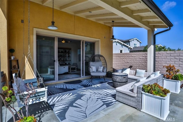 view of patio with outdoor lounge area and fence