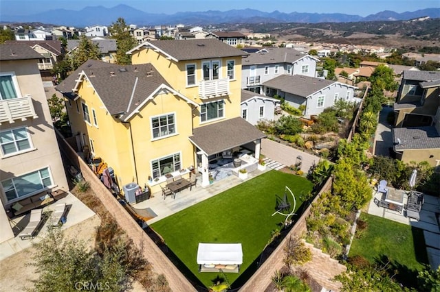aerial view featuring a mountain view and a residential view