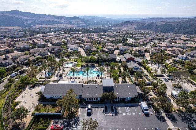 birds eye view of property with a mountain view and a residential view