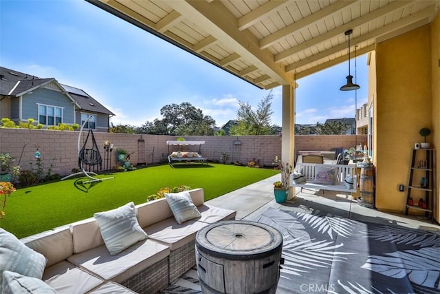 view of patio featuring outdoor lounge area and a fenced backyard