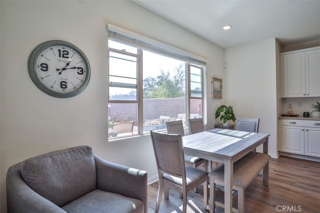 dining area featuring baseboards, dark wood-style floors, and recessed lighting
