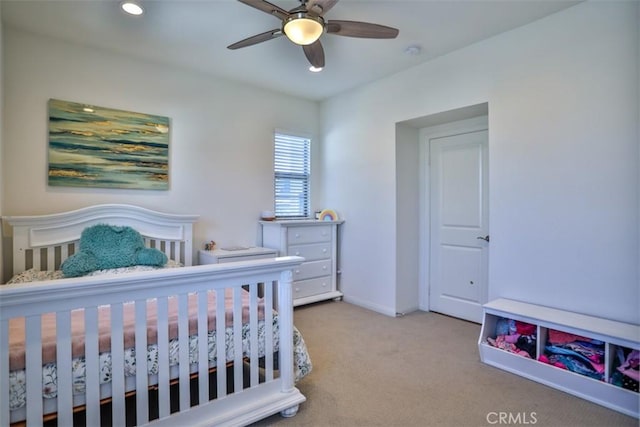carpeted bedroom with a ceiling fan, baseboards, and recessed lighting