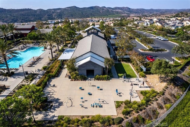 birds eye view of property featuring a mountain view