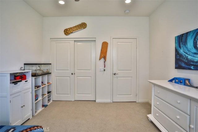 rec room with baseboards, recessed lighting, and light carpet