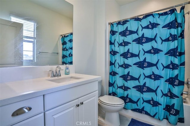 bathroom featuring toilet, shower / tub combo, and vanity