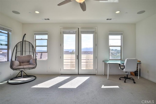 interior space featuring french doors, carpet flooring, and a healthy amount of sunlight