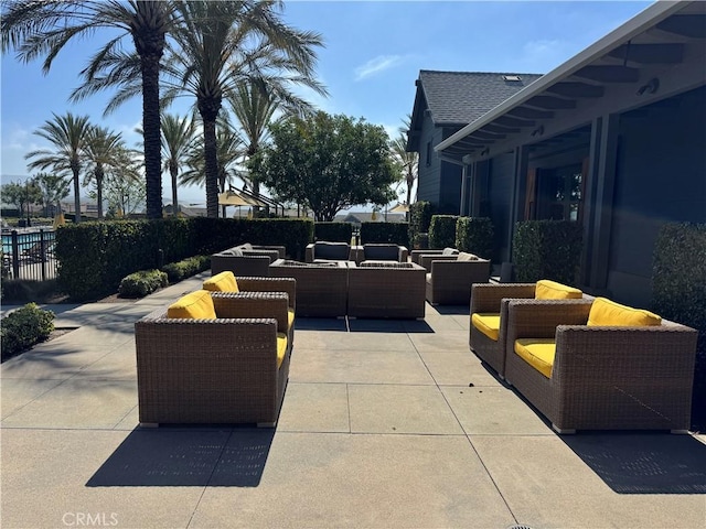 view of patio / terrace featuring outdoor lounge area and fence