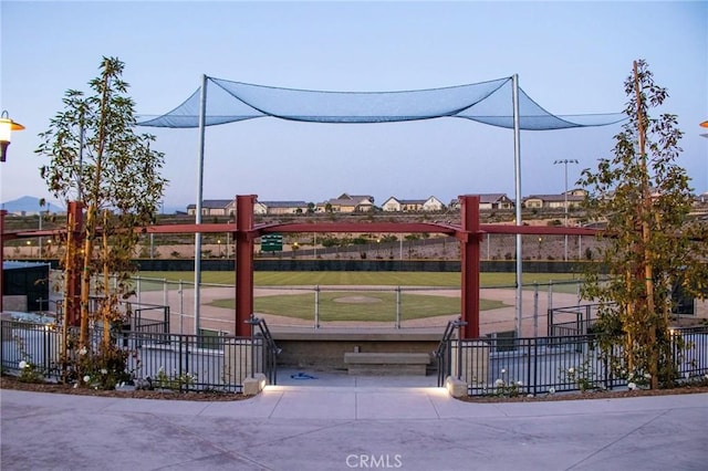 view of home's community featuring fence and a lawn