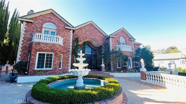 view of front of property featuring brick siding