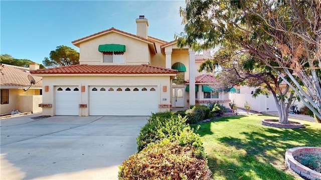 mediterranean / spanish-style home featuring a front yard, concrete driveway, a chimney, and stucco siding